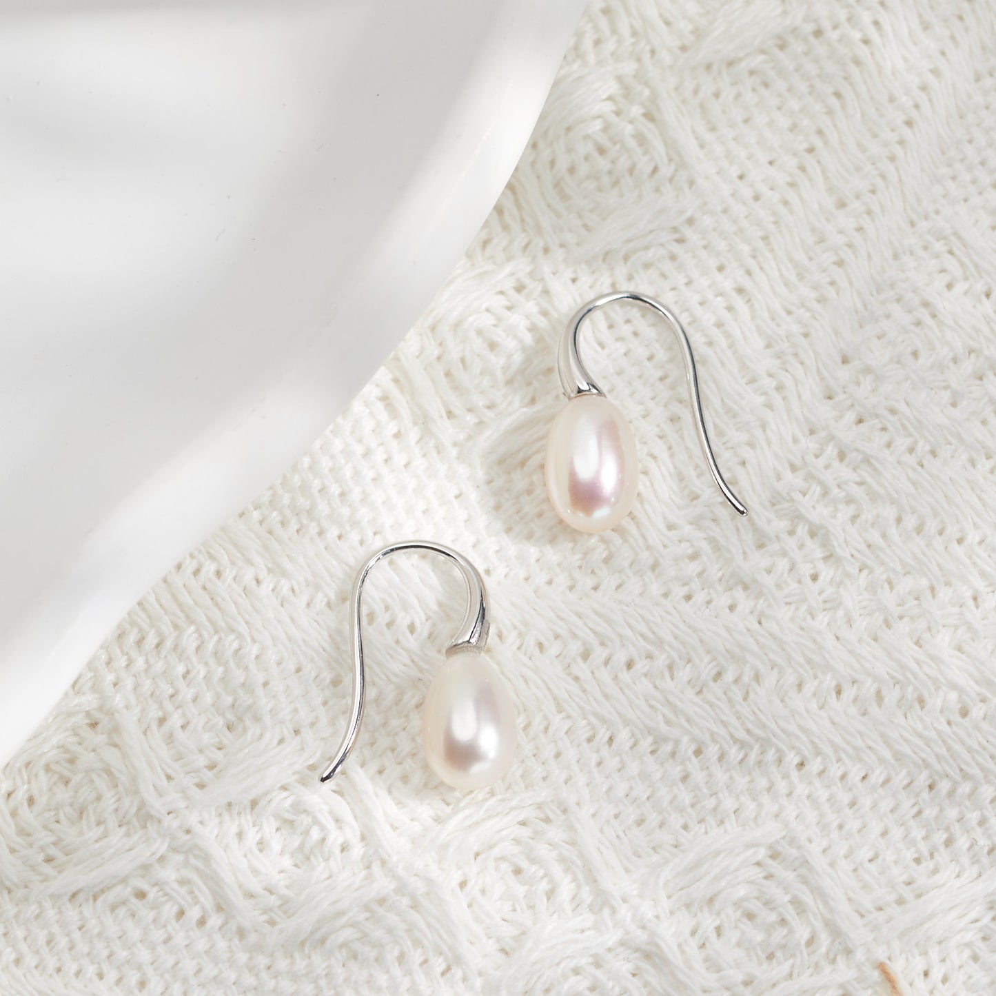 E412001 - Kisspearl Jewelry 7x10mm Rice Pearl Silver Earrings